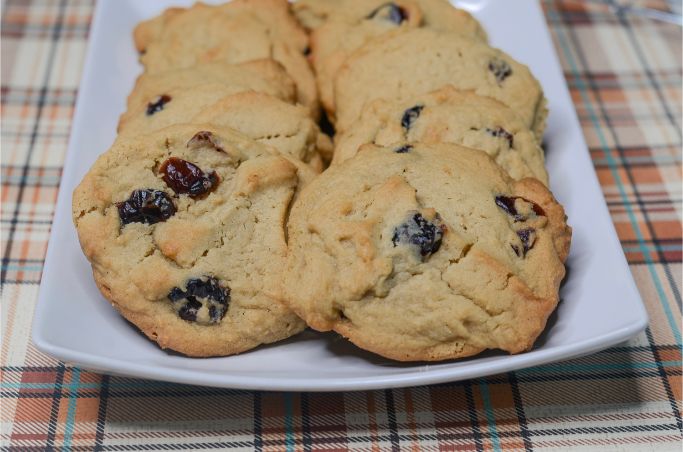 cranberry cookies arranged on a white plate