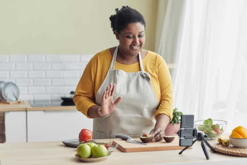 woman cooking and vlogging